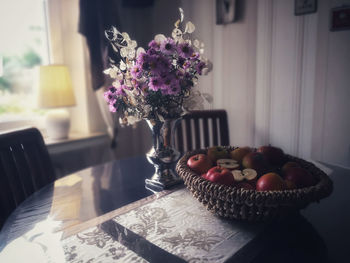 Flower vase on table at home