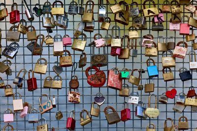 Close-up of padlocks hanging on metal