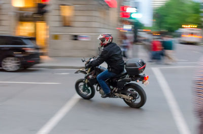 People riding bicycle on city street