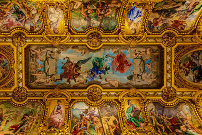 Low angle view of ornate ceiling in temple