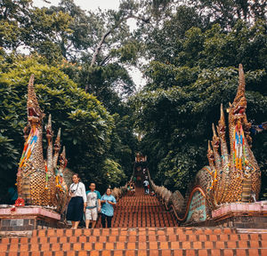 Rear view of a statue against trees