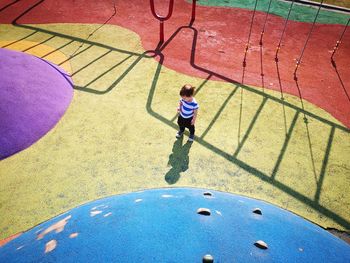 High angle view of people walking on footpath