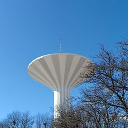 Low angle view of tree against clear blue sky