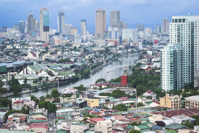 High angle view of buildings in city against sky