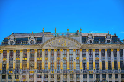 Low angle view of building against blue sky