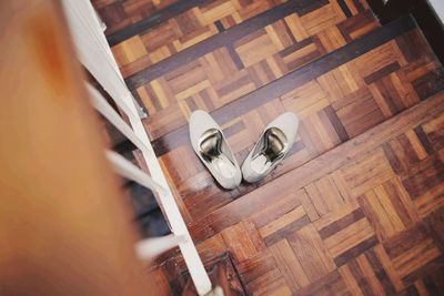 High angle view of shoes on hardwood floor