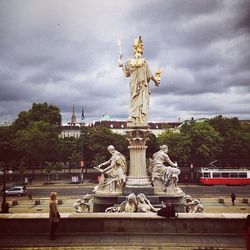 Statue of liberty against cloudy sky