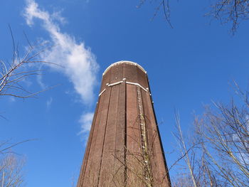 Low angle view of smoke stack against sky