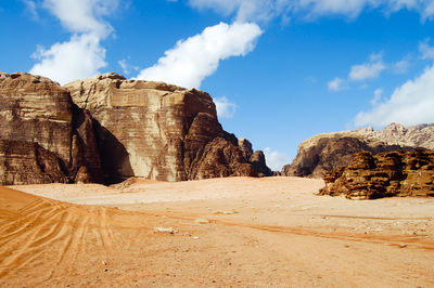 Rock formations in desert against sky