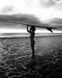 Woman standing on beach