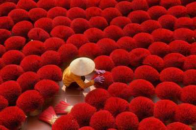 High angle view of women holding incense sticks 