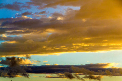 Low angle view of dramatic sky during sunset