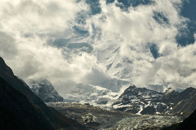 Scenic view of snowcapped mountains against sky