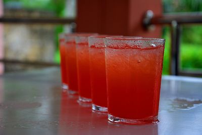 Close-up of red drink on table