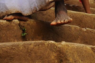 Low section of man descending down adams peak