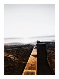 Scenic view of beach against clear sky