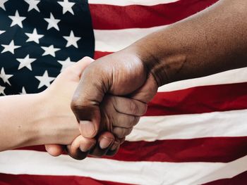 Cropped hands of person holding flag