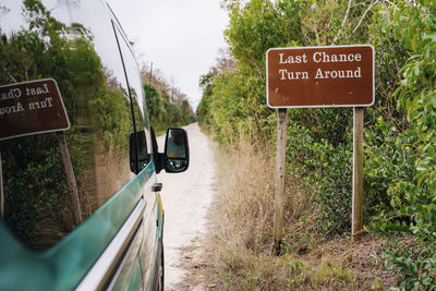 Campervan by signboard at everglades national park