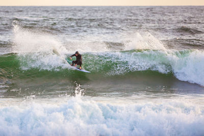 Man surfing in sea