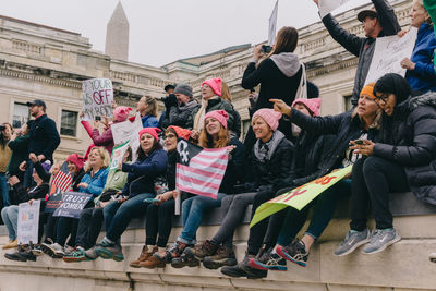 Group of people in front of buildings