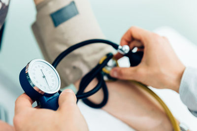 Cropped image of doctor examining patient