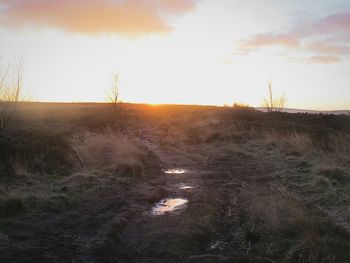 Scenic view of landscape against sky during sunset