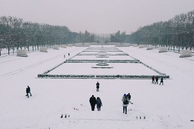 Person standing on snow covered landscape