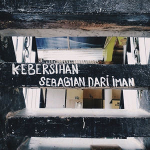 Close-up of text on snow covered metal