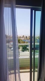 Buildings seen through glass window