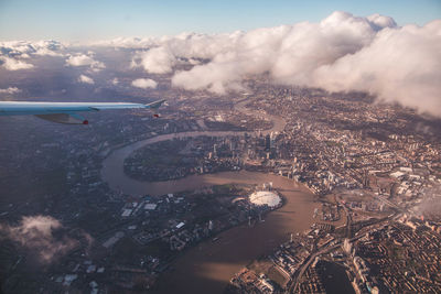 Aerial view of cityscape and sea against sky