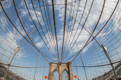 Low angle view of bridge against blue sky