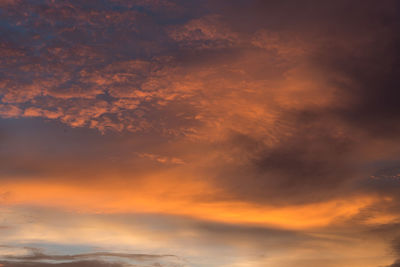 Low angle view of dramatic sky during sunset