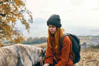 Young man with horse in winter