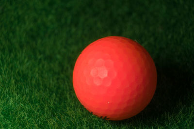 Close-up of red ball on grass