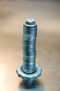 Close-up of metal container on table