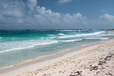 Scenic view of beach against sky