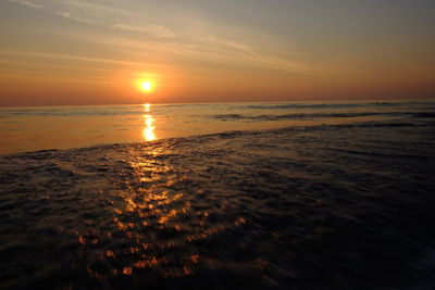 Scenic view of sea against sky during sunset