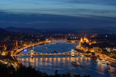 High angle view of illuminated bridge over river at night