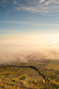 High angle view of land against sky during sunset