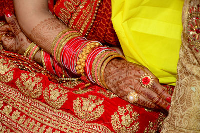 Low section of woman standing on carpet