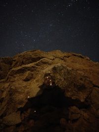 Scenic view of mountain against sky at night