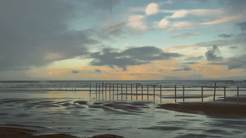 Scenic view of sea against sky during sunset