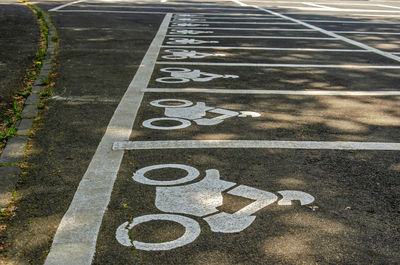 Parking spaces for motorbikes on a parking lot near the crater lakes