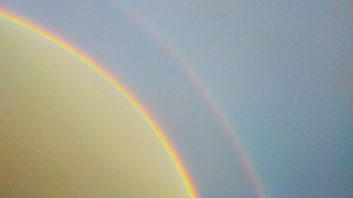 Low angle view of rainbow against sky