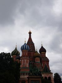 Low angle view of building against cloudy sky