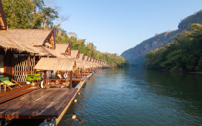 Floating bamboo houses by a river