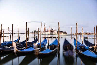 Boats moored at harbor