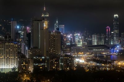 Aerial view of illuminated buildings in city at night