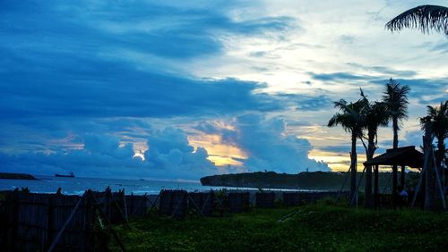 Scenic view of landscape against cloudy sky