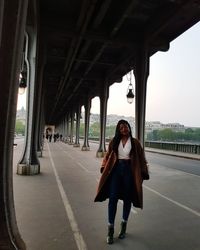 Portrait of mature woman standing on road